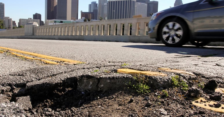 Damaged road surfaces caused by high volumes of traffic