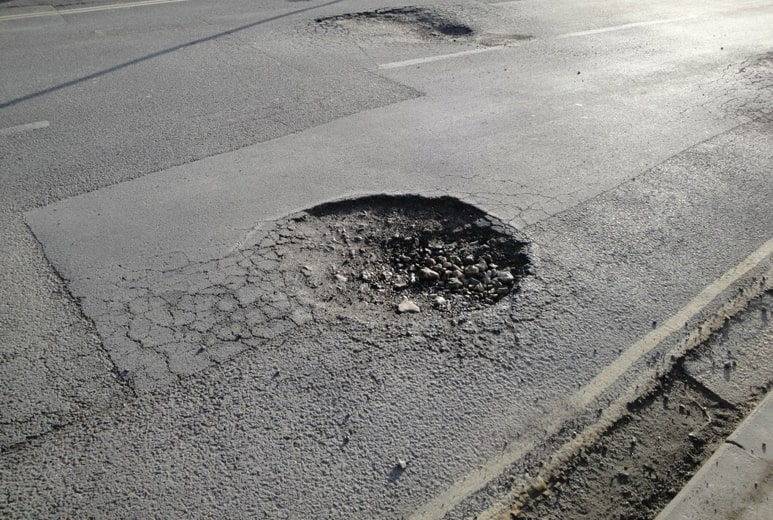 Potholes on the road